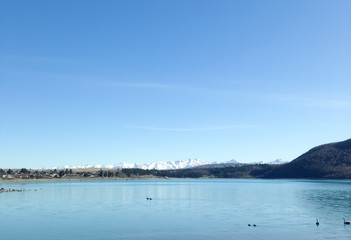 Lake with mountains covered with snow