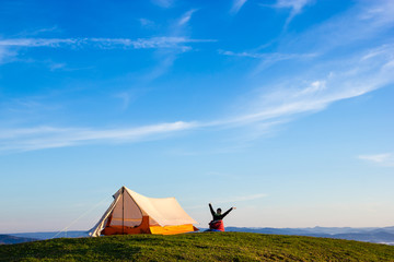 Woman Waking Up on a Mountain