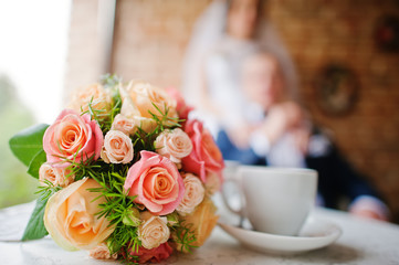 wedding bouquet at vintage cafe background newlywed