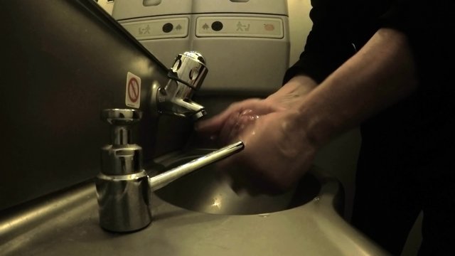 Plane, train toilet hand wash in dark atmosphere. UHD 4K stock footage