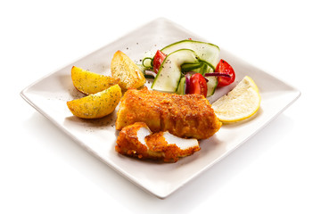 Fish dish - fried fish fillet and vegetables 