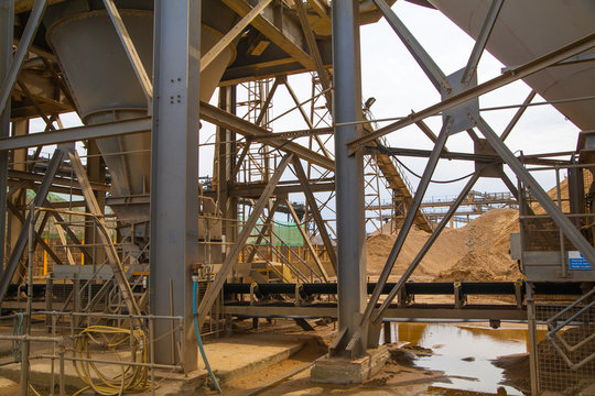 LONDON, UK - MAY 4, 2015: Industrial site at the River Thames. Cement supply. Containers against of sunset light