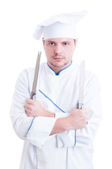 Skilled chef or cook holding two knifes or blades