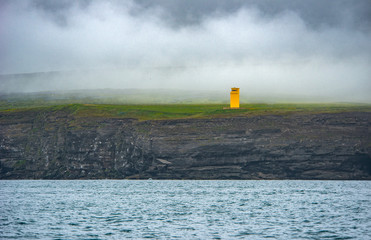 Lighthouse on a icelandic cliff