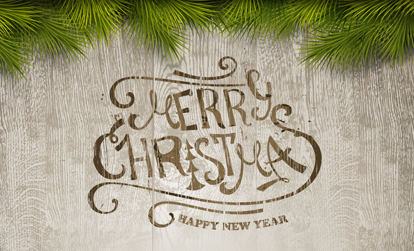 Christmas typography on wooden texture