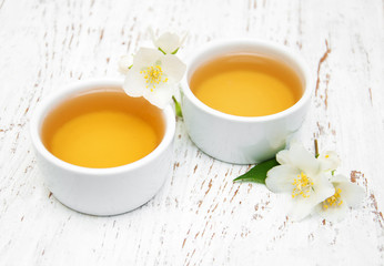 Cup of tea with jasmine flowers
