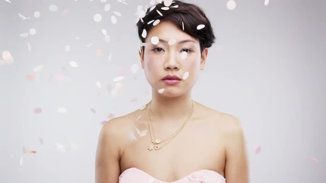 serious asian woman confetti shower slow motion wedding photo booth series