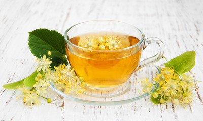 Cup of herbal tea with linden flowers