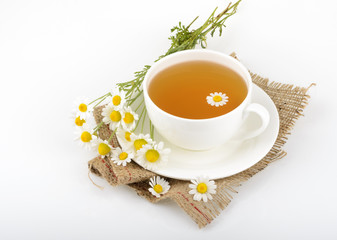 Cup of tea and chamomiles