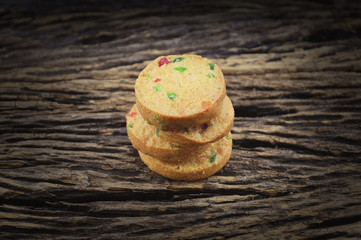 Mixed fruits cookies on old wooden background
