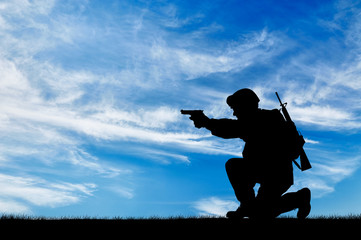 Silhouette of a soldier with a pistol