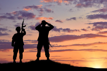 Fototapeta na wymiar Silhouette of two soldiers