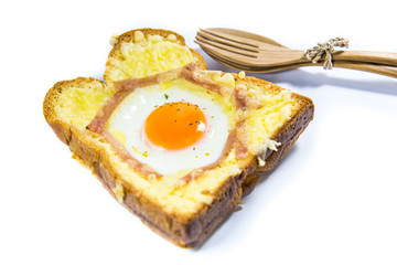 Cooked egg on bread with bacon isolated on white background