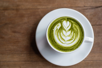 Matcha Latte on Wooden Background
