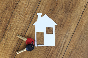 concept of couple decides to live together. keys and the house symbolizes the decision couples start living together