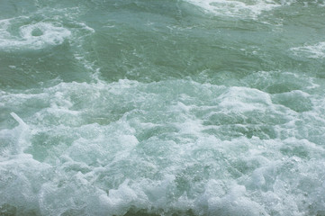 Fototapeta na wymiar Detail of Rough water from waves