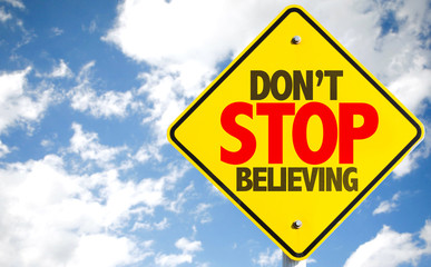 Don't Stop Believing sign with sky background