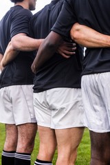 Rugby players standing together before match
