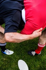 Fototapeta premium Rugby players doing a scrum