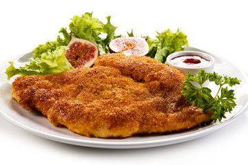 Fried pork chop coat in breadcrumbs and vegetable salad 