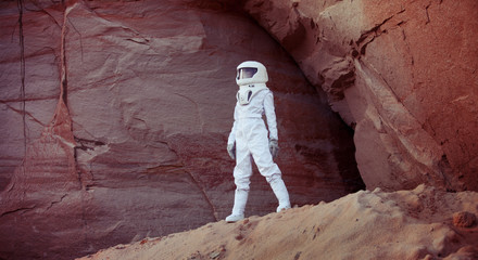 futuristic astronaut on another planet, image with the effect of © Ulia Koltyrina