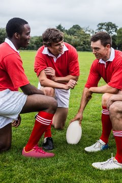 Rugby players discussing tactics before match