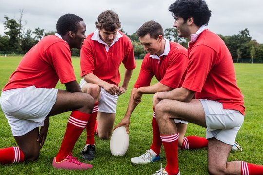 Rugby players discussing tactics before match