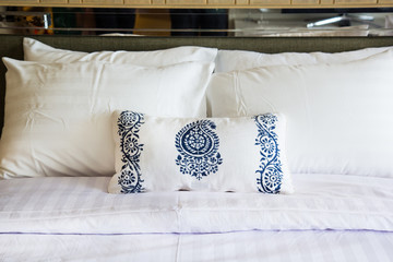 Design of the white  pillow covers on the  double bed