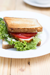 Healthy ham sandwich with cheese, tomatoes and lettuce