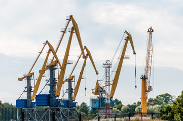 Fototapeta na wymiar cargo cranes in the port of