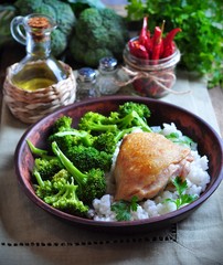 roasted chicken with rice and broccoli, rustic style