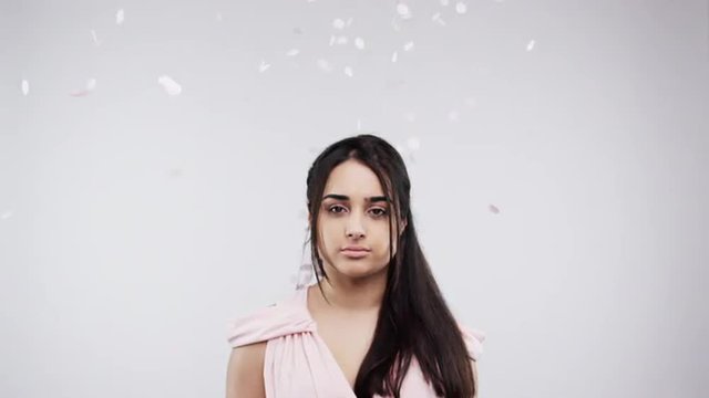 Lonely bridesmaid woman in confetti shower slow motion wedding photo booth series