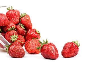 strawberries poured from transparent plates