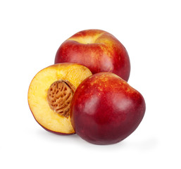 Fototapeta na wymiar two half nectarine on the background of a fruit in isolation