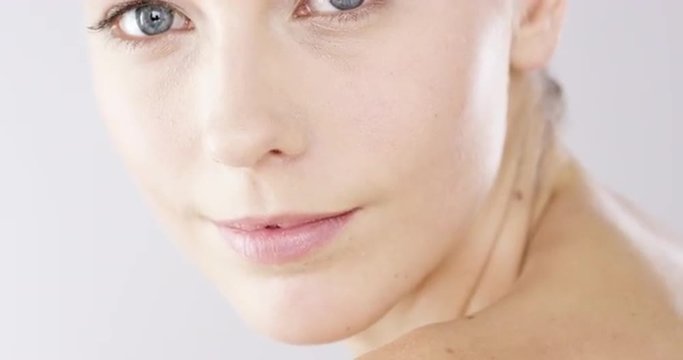 Closeup Beauty portrait of woman face with bright blue eyes slow motion skincare concept - Red Epic Dragon