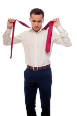 Young man removes a suit isolated on white. Businessman or stude