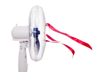 Working air fan with red ribbons isolated on white. Air movement