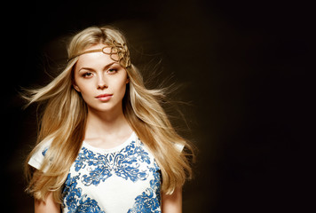 Fototapeta premium Portrait of beautiful blonde woman in white elegant dress with