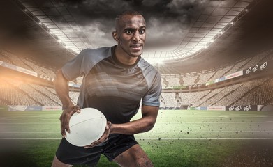 Composite image of rugby player in position to throw ball
