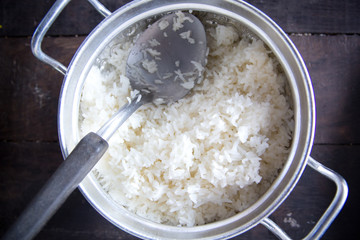 Stream jasmine rice in silver pot