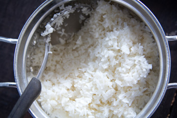Stream jasmine rice in silver pot