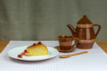Biscuit homemade gooseberry jam, coffee cup and pot