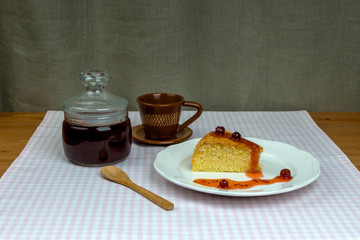 Glass jar with gooseberry jam and homemade biscuit