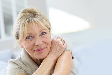 Portrait of senior woman relaxing in couch