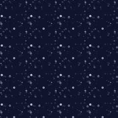 White snow falling on dark background
