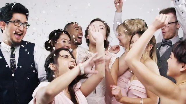 Multi racial group dancing slow motion wedding photo booth series
