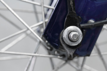 Close up a bolts that hold the wheel bicycle
