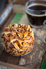 chocolate cake with almond nut on top and hot americano coffee