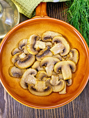 Champignons fried in ceramic pan top