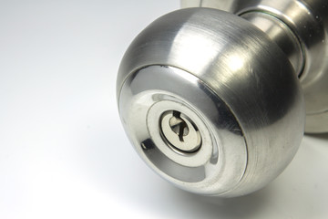 close up metal doorknob on white background